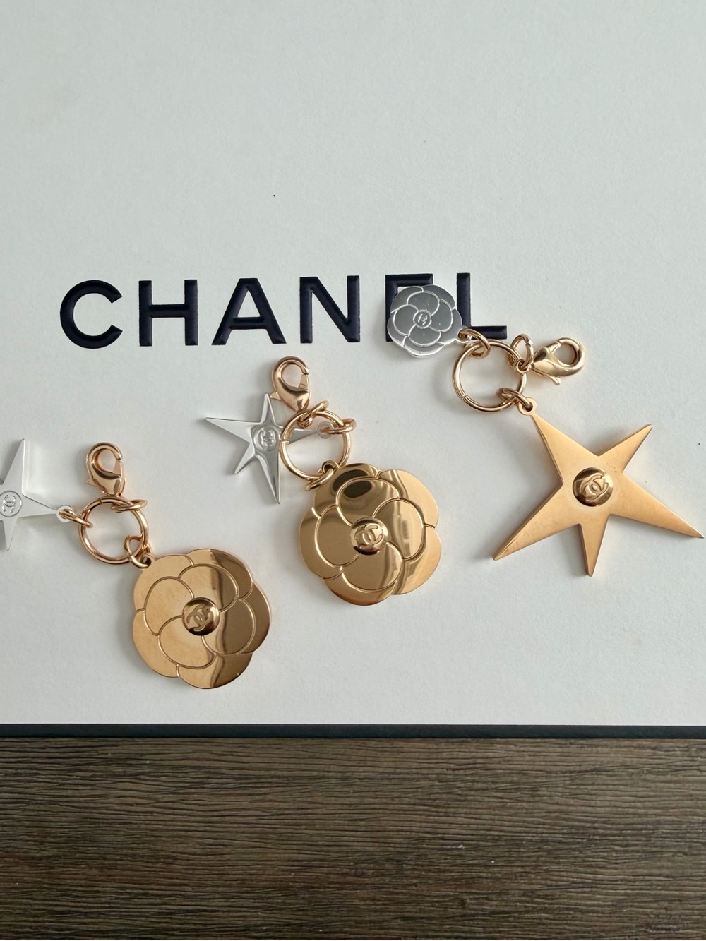 CHANEL Rose Gold Camellia & Star Charm Collection